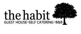 The Habit Guest House logo